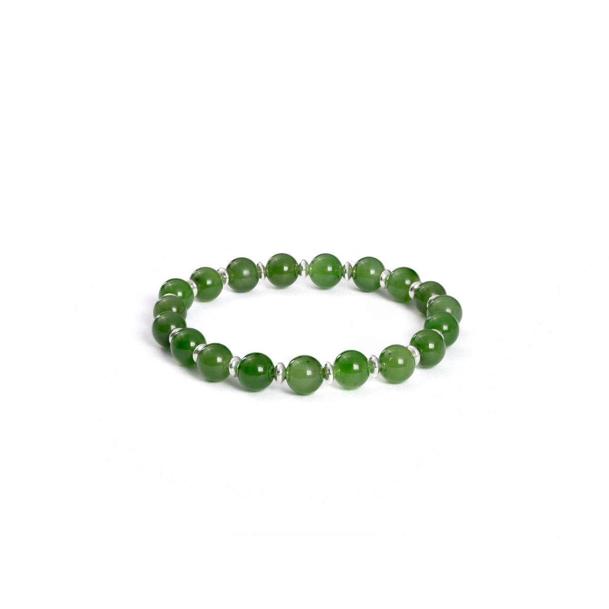 A bracelet featuring a series of round green Nephrite jade beads separated by sterling silver spacers, on a white background.