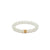 A bracelet featuring white mutton fat jade beads with a gold or silver accent, displayed on a white background.
