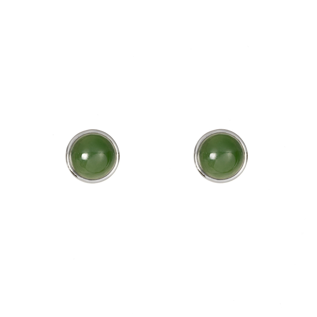 Pair of round green earrings with silver rims on a white background