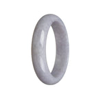 A close-up view of a stunning half moon shaped lavender Burma Jade bracelet. The bracelet is made from genuine Grade A jade, showcasing its natural beauty and elegance. The smooth and polished surface reflects light, highlighting the rich lavender color and intricate patterns of the stone. This bracelet from MAYS is a timeless piece of jewelry that exudes grace and sophistication.