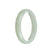 A half-moon shaped white jadeite jade bracelet, crafted from genuine grade A jade. The bracelet has a diameter of 56mm and is beautifully designed by MAYS.
