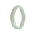 A close-up image of a white Burma jade bangle, half moon shaped, with a diameter of 56mm. The bangle is made of genuine Type A jade, displaying its beautiful and unique natural patterns. Sold by MAYS GEMS.