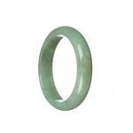 A beautiful half moon shaped bracelet made of genuine natural light green Burmese jade, measuring 58mm in size. Perfect for adding a touch of elegance to any outfit.