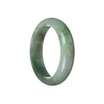 A half-moon shaped green and lavender Burma Jade bangle bracelet with a shiny surface. A beautiful and unique half-moon shaped jade bangle bracelet with shades of green and lavender, showcasing its high-quality grade A Burma Jade.
