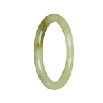 A small, round light green jade bangle made of genuine, untreated jade.