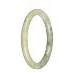 A half moon-shaped bangle made of untreated pale green Burma jade with a dark green pattern.