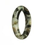 A close-up photo of a beautiful grey jade bangle with brown and black patterns. The bangle is 56mm in size and has a unique half moon shape. Perfect for those who appreciate genuine jadeite jade.