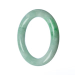 A beautiful round green Burmese jade bangle, measuring 58mm in size.