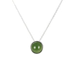 A round cabochon-cut nephrite jade stone pendant in 925 sterling silver bezel setting, with a free silver chain.