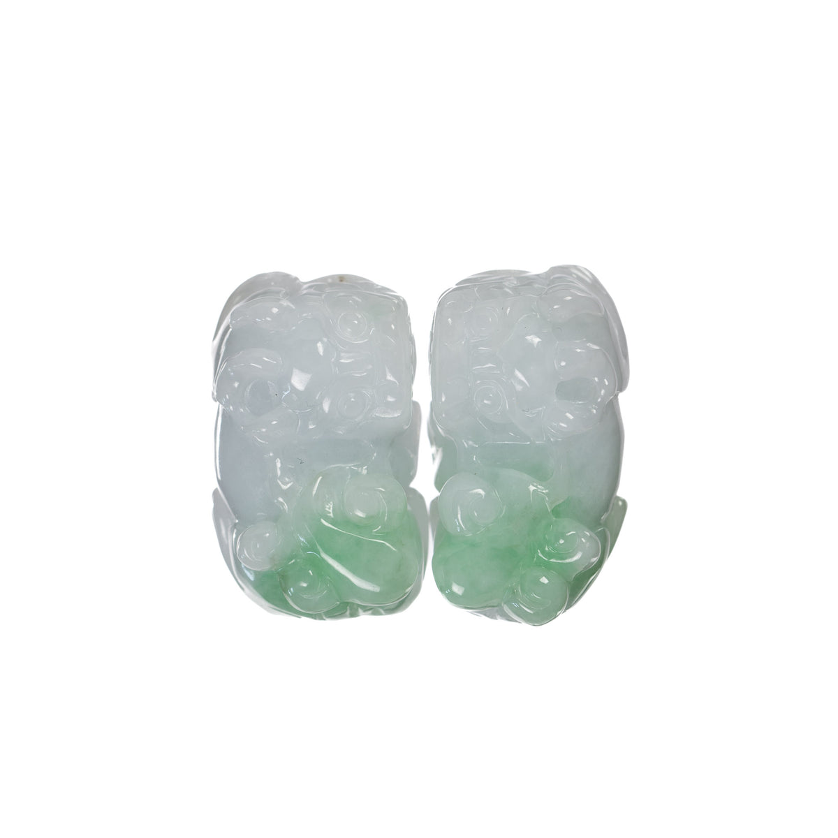 Pair of Apple Green and White Jade Pixiu Pendants