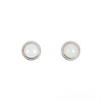 A pair of white jade round stud earrings in sterling silver with milgrain edge detailing.