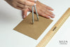 drawing a circle with compass on a cardboard. mays jade bangle sizing guide.