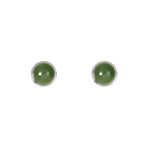 Pair of round green earrings with silver rims on a white background