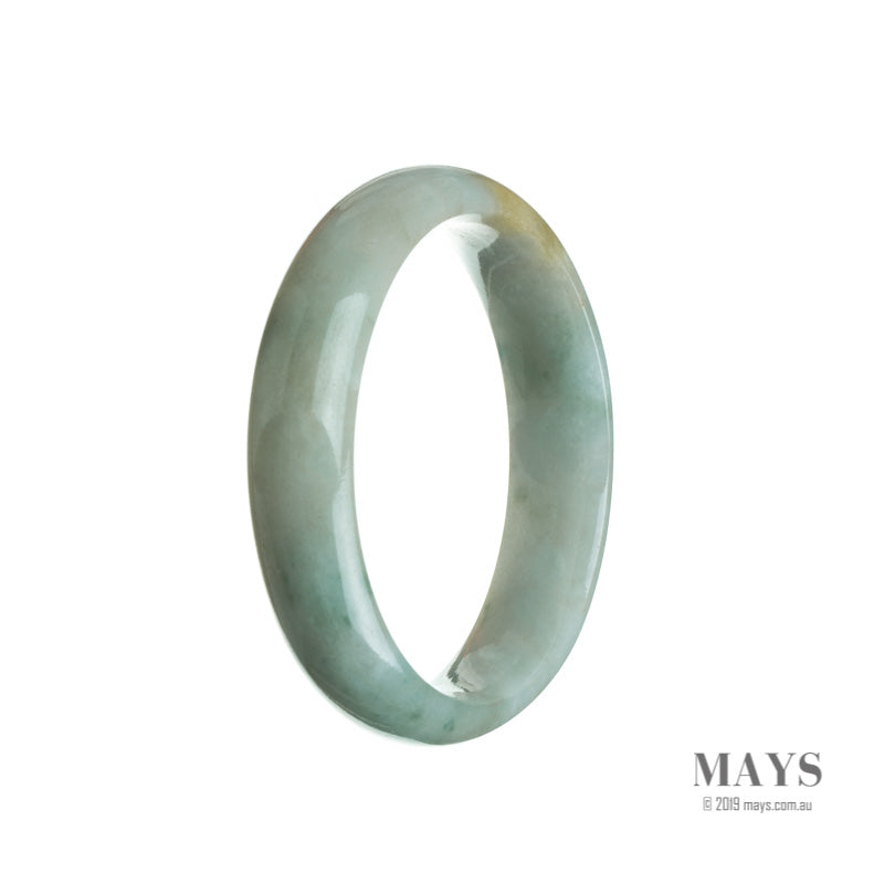 Close-up image of a half-moon shaped, light green Burmese jade bangle, showcasing its genuine natural beauty and intricate craftsmanship.