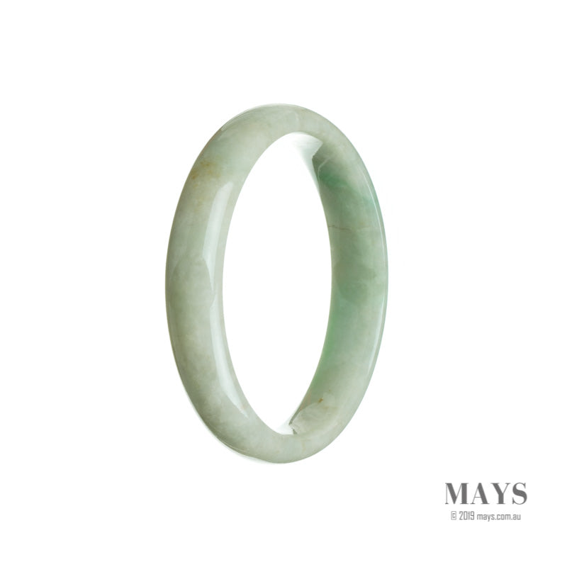 A close-up image of a light green jade bracelet, carved in a half-moon shape, with a smooth and polished surface. The bracelet is made from genuine Type A jade and measures 55mm in diameter. Created by MAYS GEMS.