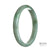 A close-up image of a traditional jade bangle bracelet, showcasing its genuine untreated brownish green color. The bracelet is shaped like a half moon and measures 77mm in size.