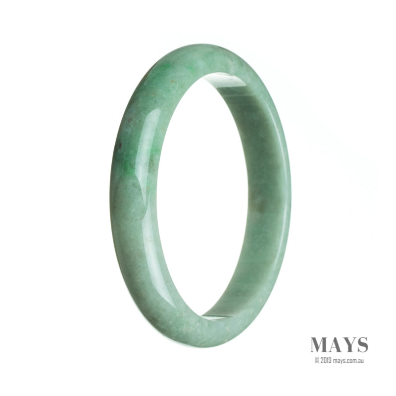 A close-up photo of a delicate green jadeite jade bracelet. The bracelet is made up of small, semi-round beads, each showcasing the vibrant green color and natural patterns of the jadeite stone. The bracelet is expertly crafted and would make a stunning addition to any jewelry collection.