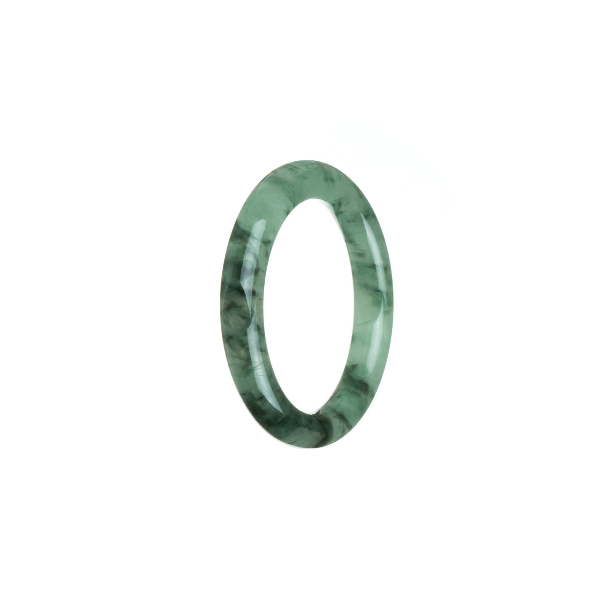 A close-up of a beautiful green jade bangle with intricate patterns, perfect for a child.