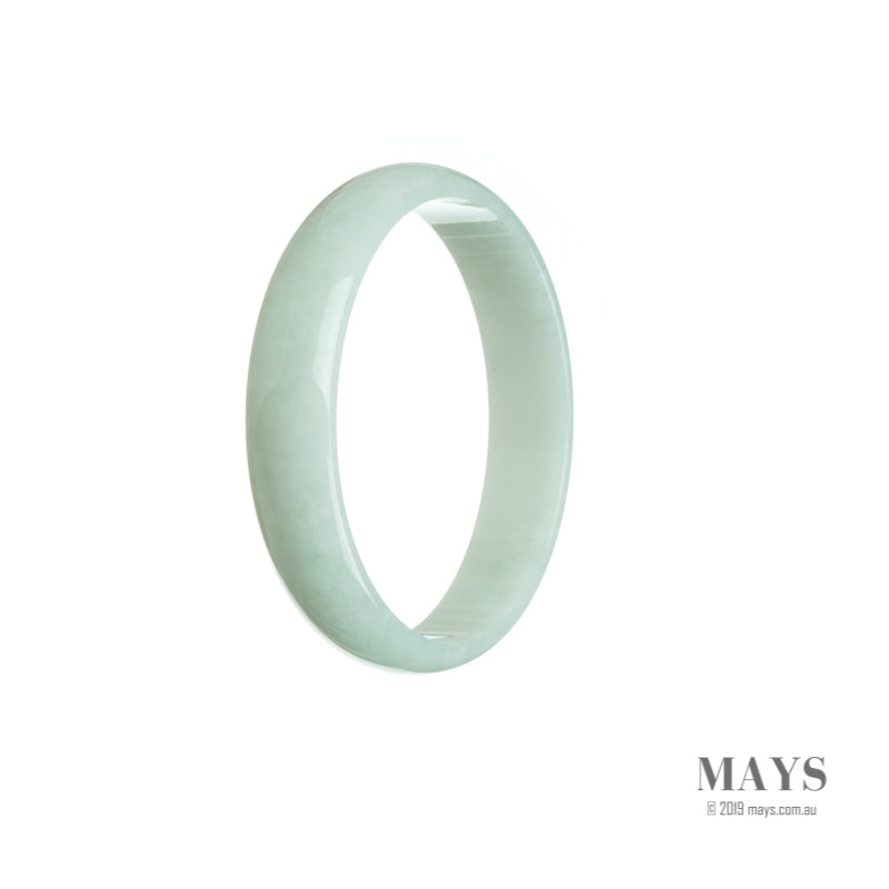 A close-up of a pale green traditional jade bangle with a smooth, flat surface, measuring 52mm in diameter.
