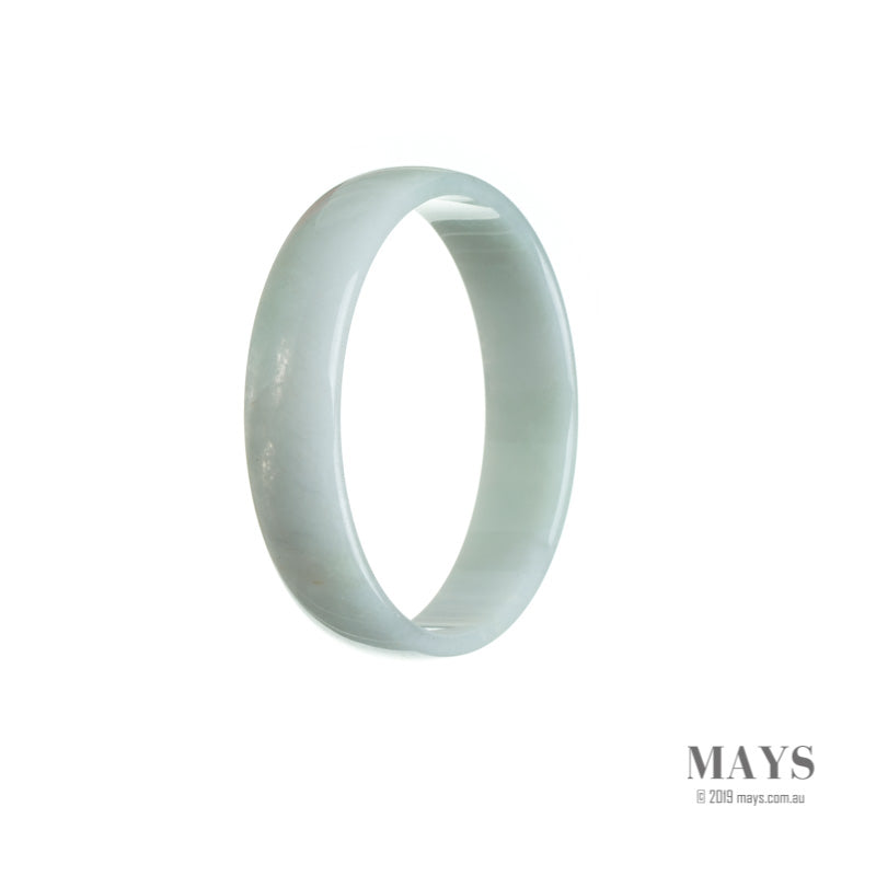 A close-up of a beautiful white jade bangle bracelet, with a smooth, flat surface. The bracelet is made from genuine, natural Burma jade and measures 52mm in diameter. Crafted with precision and care, this elegant piece of jewelry is offered by MAYS GEMS.