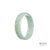 An elegant, pale green Jadeite Jade bangle with a flat design, certified as Grade A quality. Perfect for adding a touch of natural beauty to any outfit.