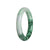 An elegant round Burma Jade bracelet with a natural untreated green color and unique pattern, measuring 52mm.