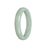 A light green jade bracelet with a half moon shape, measuring 56mm in size.