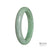 A close-up photo of an authentic Grade A Green Burma Jade Bangle, measuring 58mm in diameter and featuring a semi-round shape. The bangle is from the brand MAYS.