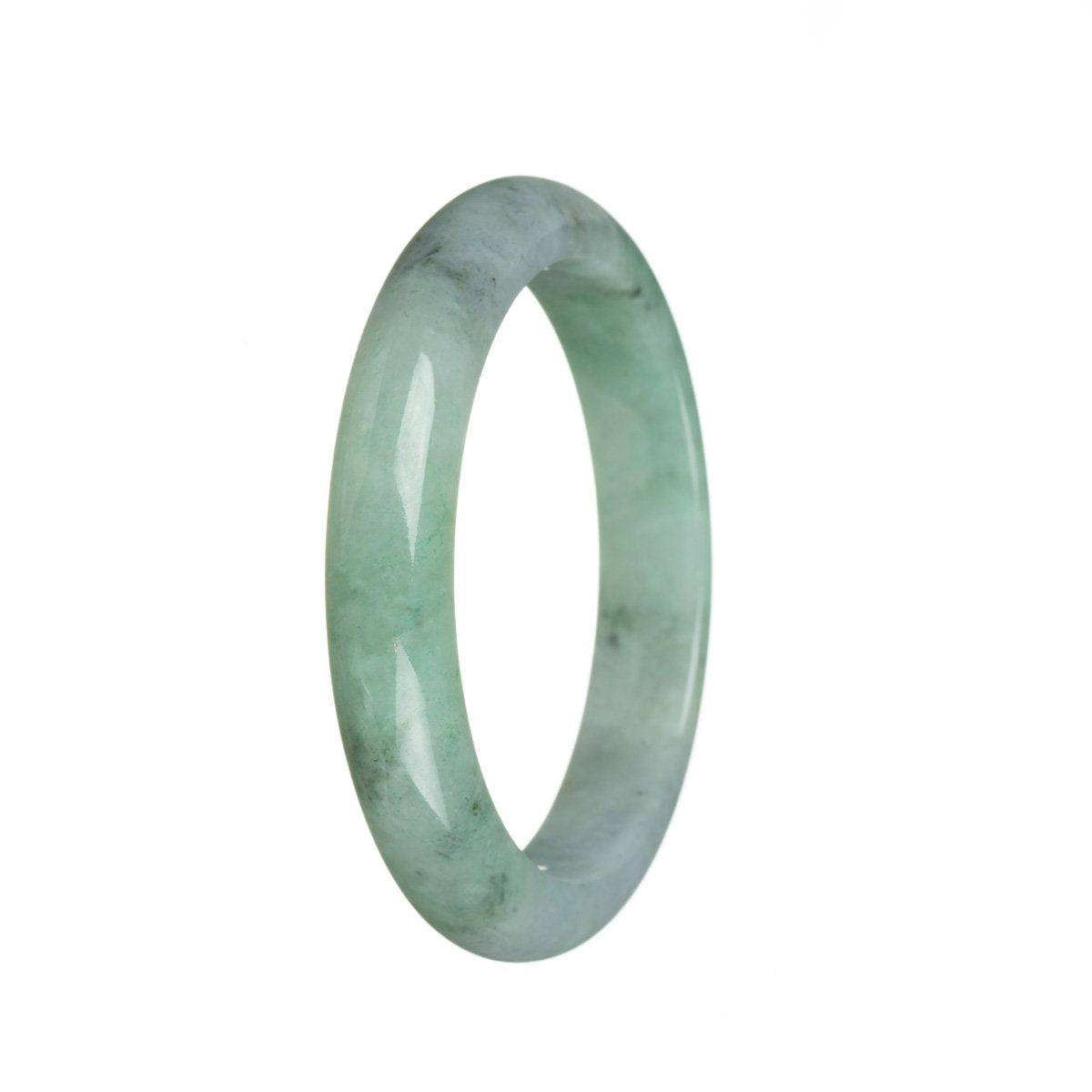 A close-up photo of a beautiful, green jade bangle with a smooth, semi-round shape. This high-quality piece is certified Grade A and is made from traditional jade. The bangle has a 60mm diameter and is sold by MAYS GEMS.