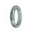 A close-up image of a beautiful white flower Burma Jade bracelet with a half moon design, measuring 55mm.
