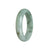 A pale green Burmese Jade bracelet with a half moon design, measuring 55mm.