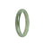 Close-up image of a light green jade bracelet with a half-moon shape, measuring 55mm. The bracelet is certified as Grade A and is sold by MAYS GEMS.