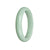 A light green jade bangle with a half-moon shape, measuring 59mm in diameter. This bangle is made of authentic Grade A jade and is sold by MAYS GEMS.