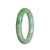 A round, green traditional jade bangle of authentic Grade A quality, measuring 56mm in diameter. This bangle is a stunning piece from MAYS™.