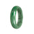 A beautiful, high-quality half-moon shaped jade bangle made from real Grade A Imperial green sections Jade, measuring 57mm in size. A stunning statement piece from MAYS.