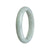 A light green jade bangle with a half moon shape, measuring 58mm in size.