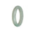 A light green jade bangle with a half moon design, measuring 53mm, made from genuine Grade A jade.