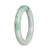 A round genuine Burma Jade bangle with a green color, measuring 56mm in size.