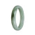 A close-up image of a green jade bangle bracelet with a half moon shape, made of real Type A Green Jadeite Jade.
