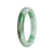 A close-up photo of a green jade bracelet with a semi-round shape. The bracelet is made of genuine Type A Green Jadeite Jade and has a diameter of 57mm. It is a product of MAYS™.
