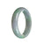A Lavender and green Jadeite bracelet with a 55mm half-moon shape, perfect for adding a touch of elegance to any outfit.