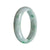 A close-up image of a traditional jade bracelet with a half-moon design. The bracelet is made of real natural green jade and is set against a white background. The bracelet measures 58mm in size and is crafted by MAYS GEMS.