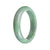 A half moon-shaped certified natural green Burma jade bracelet from MAYS GEMS.