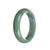 A beautiful green jade bangle with a semi-round shape, measuring 59mm in size.