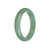 A stunning half-moon-shaped green Burmese jade bangle bracelet, certified as Grade A quality.