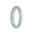 A close-up photo of a green and lavender jadeite bangle bracelet with a semi-round shape, measuring 56mm in diameter.