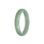 A half-moon shaped green Burma jade bangle bracelet, crafted from genuine Grade A jade.