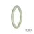 A beautiful pale green jade bangle bracelet with an oval shape. Perfect for adding a touch of elegance to any outfit.