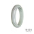A half-moon shaped bangle bracelet made of pale green Burmese jade, featuring genuine untreated lavender accents.