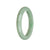 A beautiful green jadeite jade bangle bracelet with a 56mm half moon shape. Perfect for adding elegance and style to any outfit.